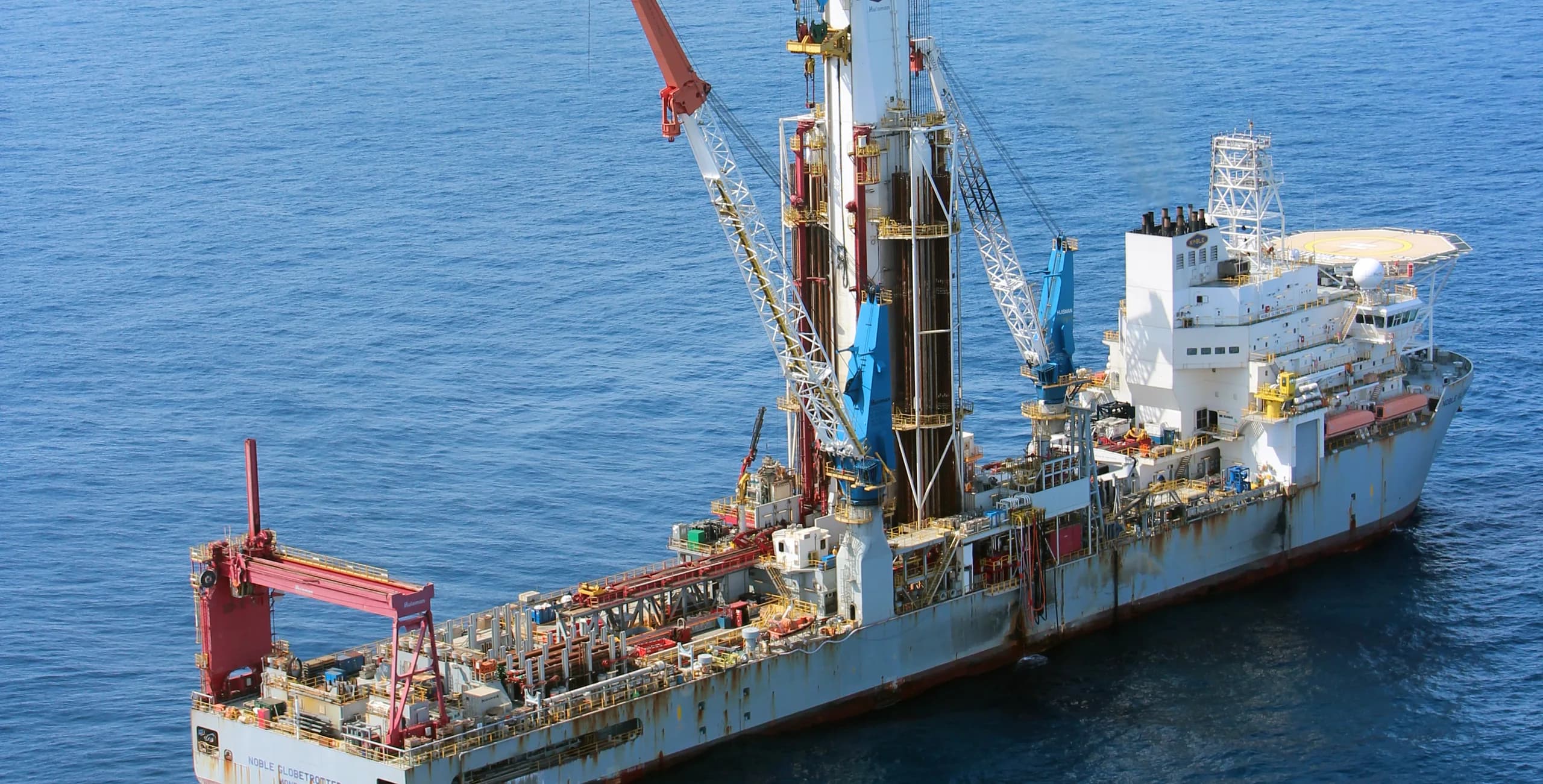Offshore drillship underway in open water