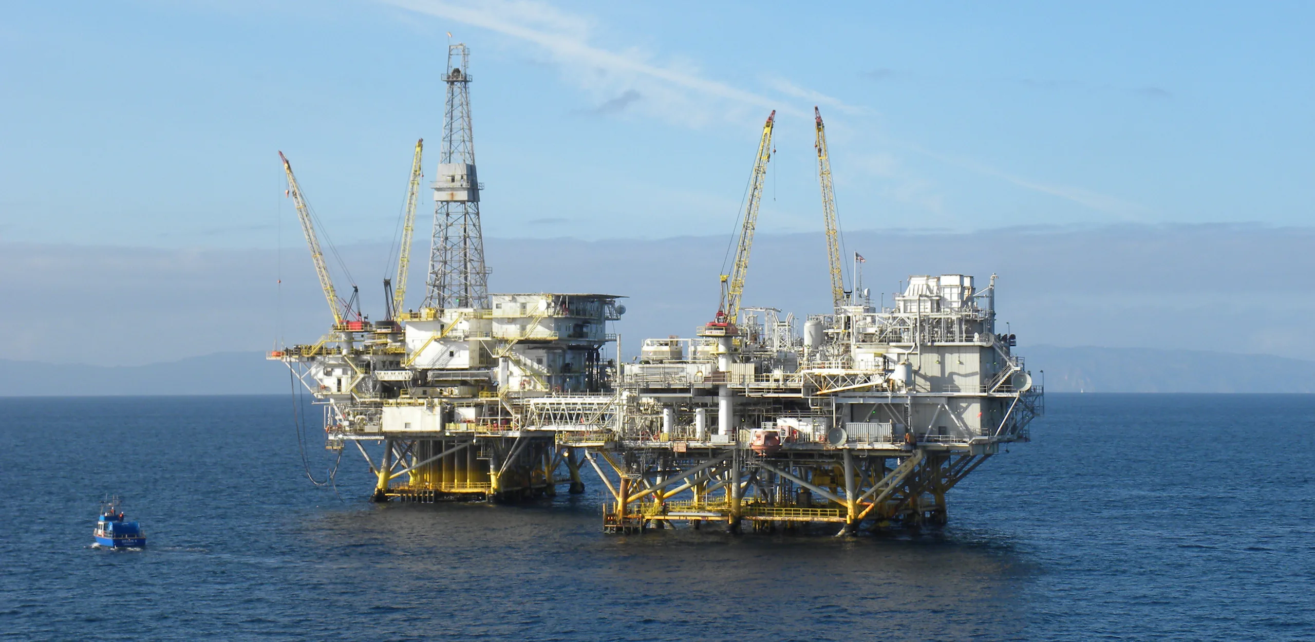 Offshore oil and gas production platforms in open water.